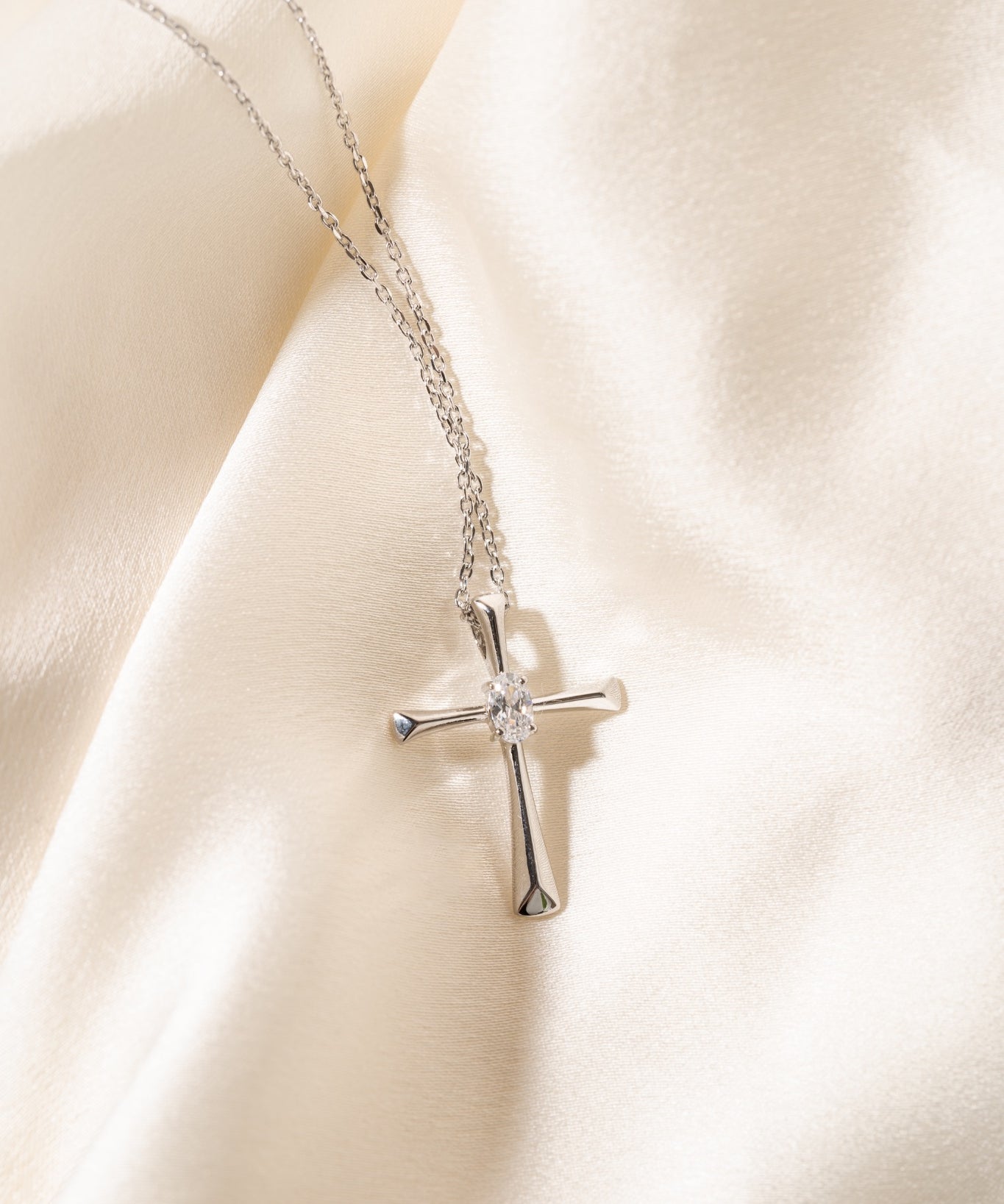Diamondlite CZ 5x3mm oval cross pendant in sterling silver at Armans Jewellers Kitchener