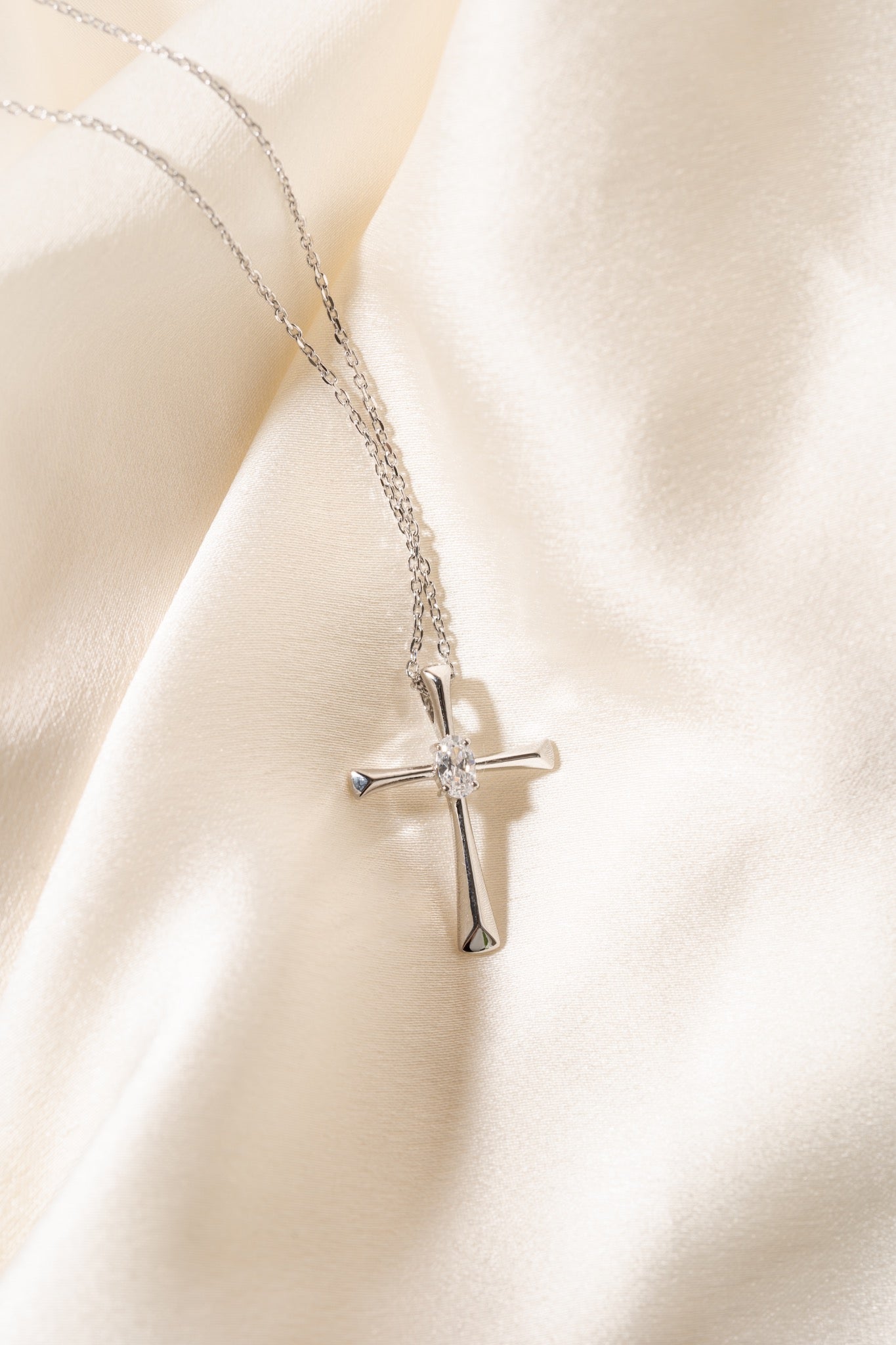 Diamondlite CZ 5x3mm oval cross pendant in sterling silver at Armans Jewellers Kitchener