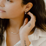 Model wearing Double Hoop Illusion Pearl Silver Earrings at Arman's Jewellers