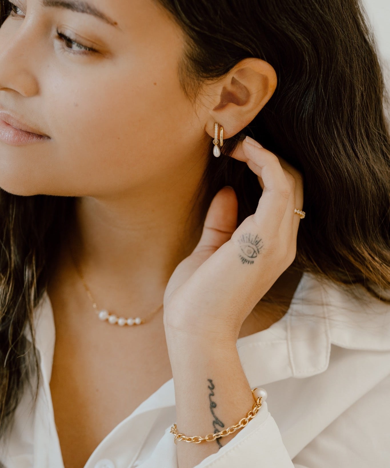 Model wearing Double Hoop Illusion Pearl Silver Earrings at Arman's Jewellers