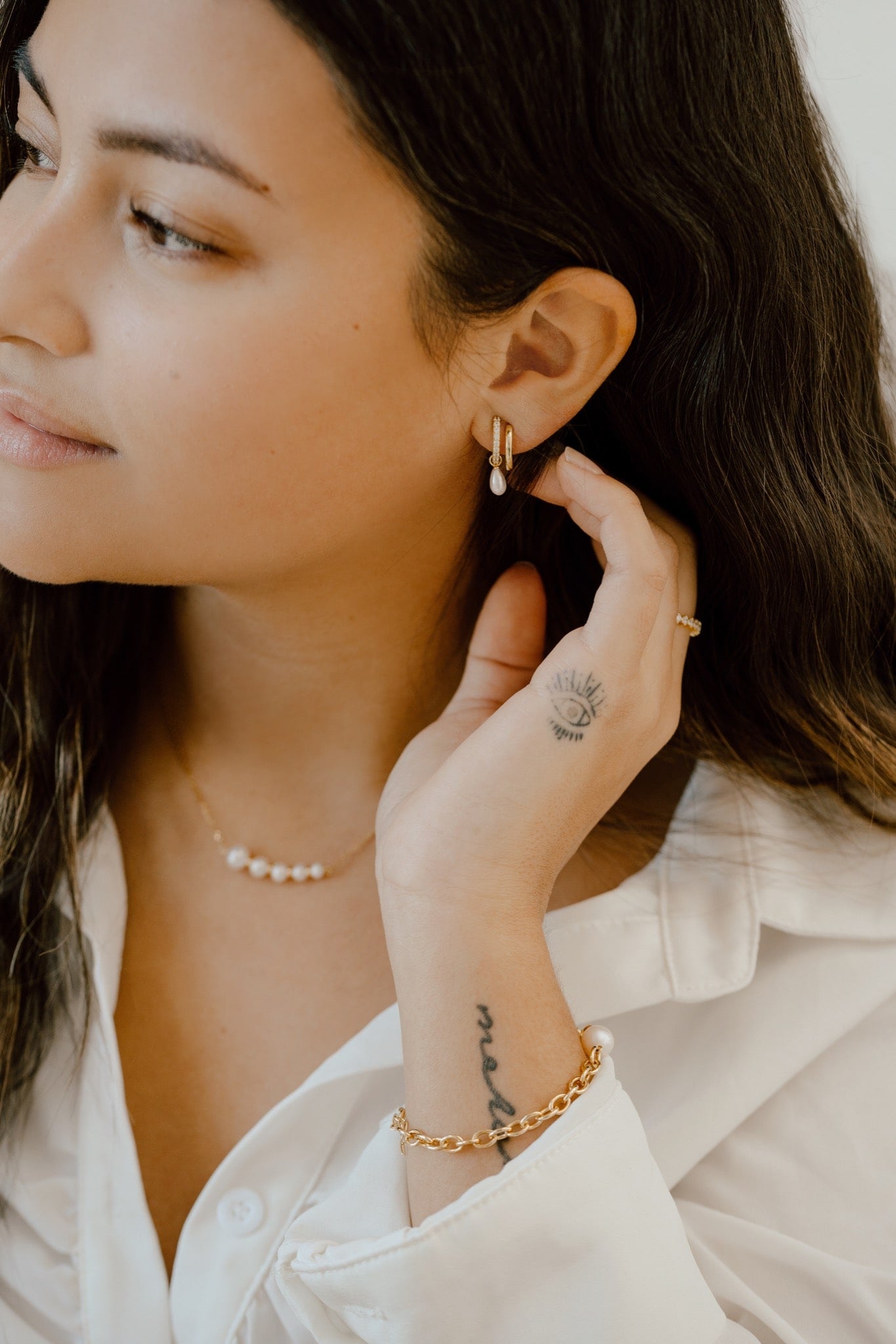 Model wearing Double Hoop Illusion Pearl Silver Earrings at Arman's Jewellers